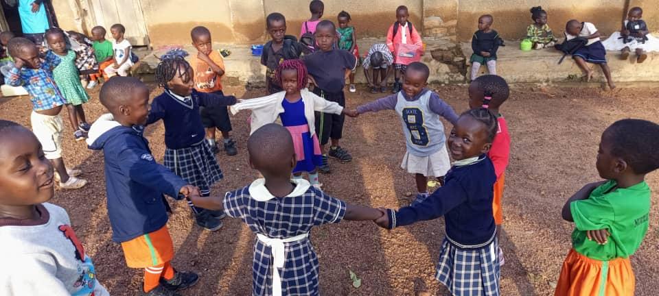 Children holding hands in a circle game